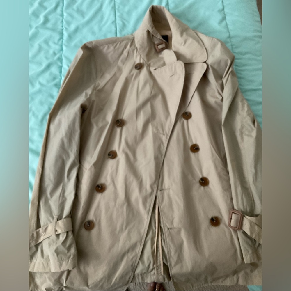 Double breasted cream man’s jacket, button detail